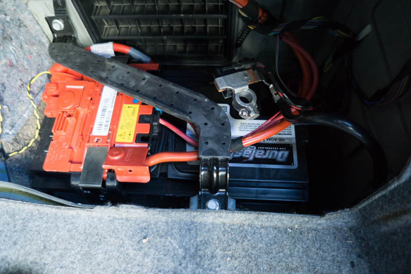 Disconnecting the negative battery terminal of a car with a wrench